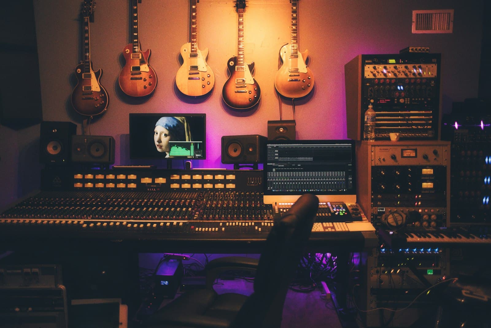 A studio desk with a camera and a screen